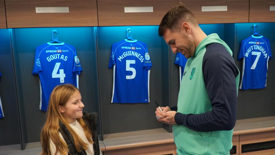 Aaron Ramsey interacts with Cardiff City fans