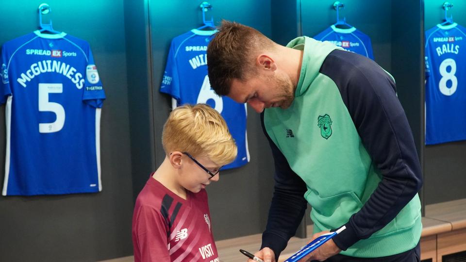 Aaron Ramsey interacts with Cardiff City fans
