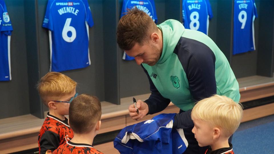 Aaron Ramsey interacts with Cardiff City fans