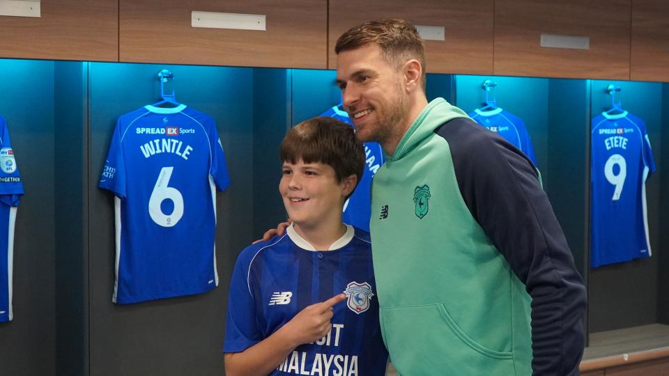 Aaron Ramsey interacts with Cardiff City fans
