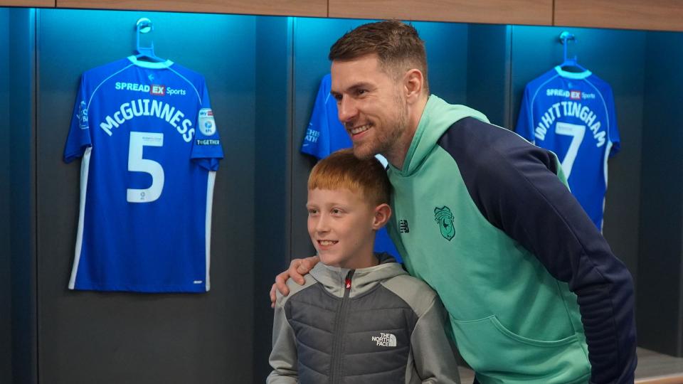 Aaron Ramsey interacts with Cardiff City fans
