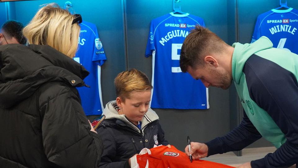 Aaron Ramsey interacts with Cardiff City fans