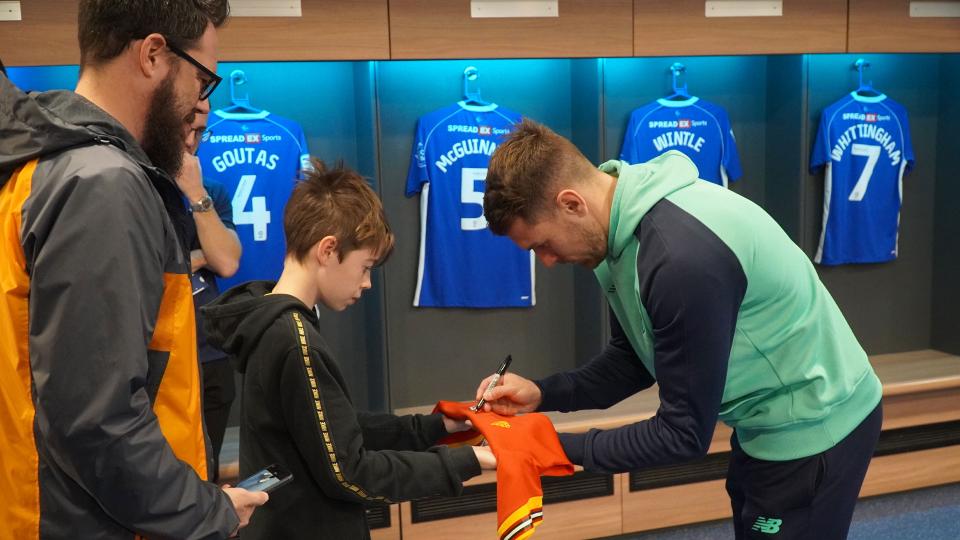 Aaron Ramsey interacts with Cardiff City fans