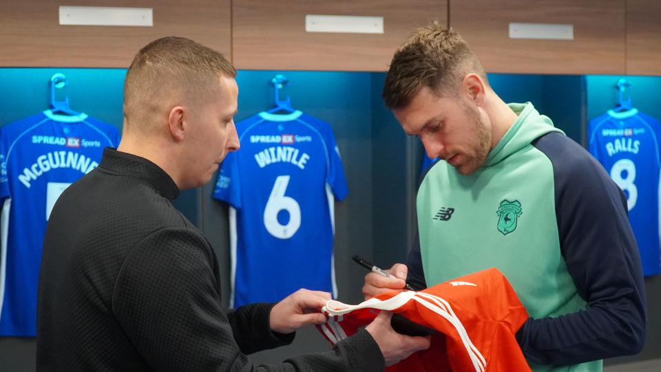 Aaron Ramsey interacts with Cardiff City fans