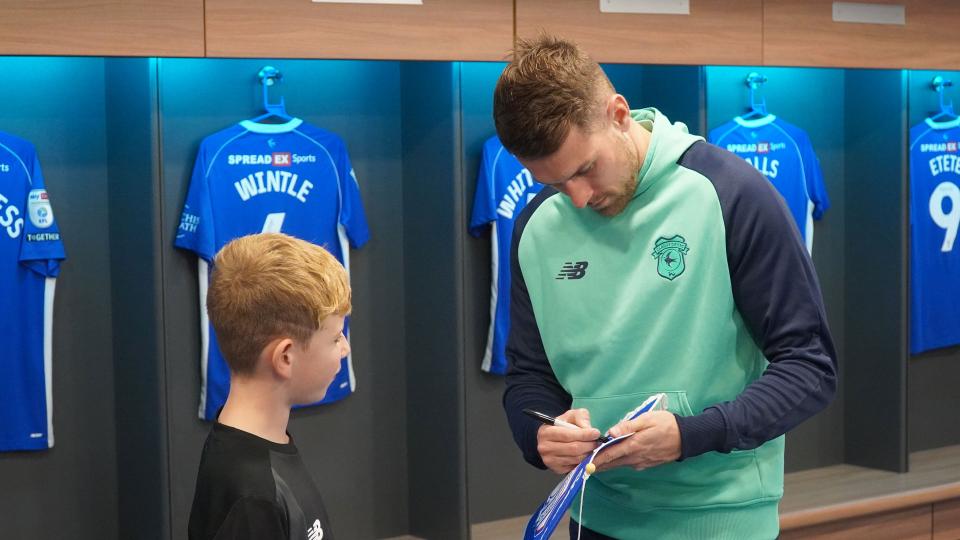 Aaron Ramsey interacts with Cardiff City fans
