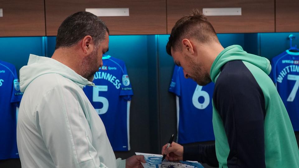 Aaron Ramsey interacts with Cardiff City fans