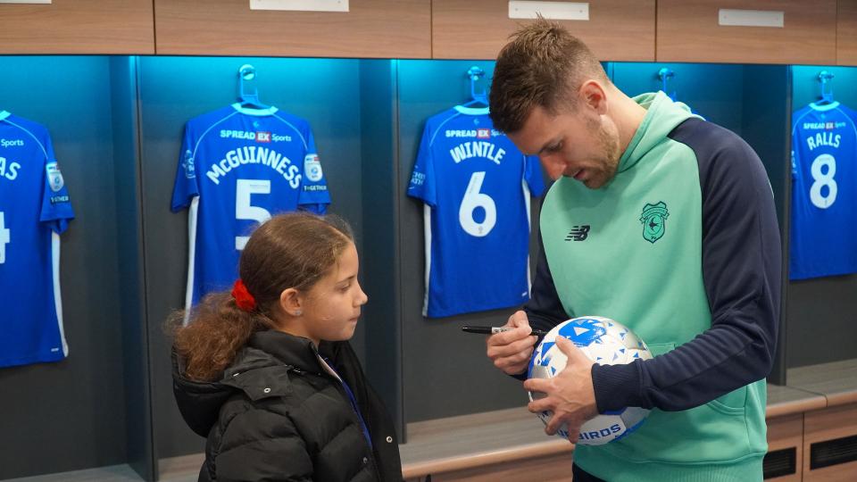 Aaron Ramsey interacts with Cardiff City fans