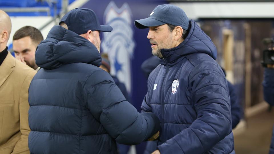 Erol Bulut shakes hands with Wayne Rooney
