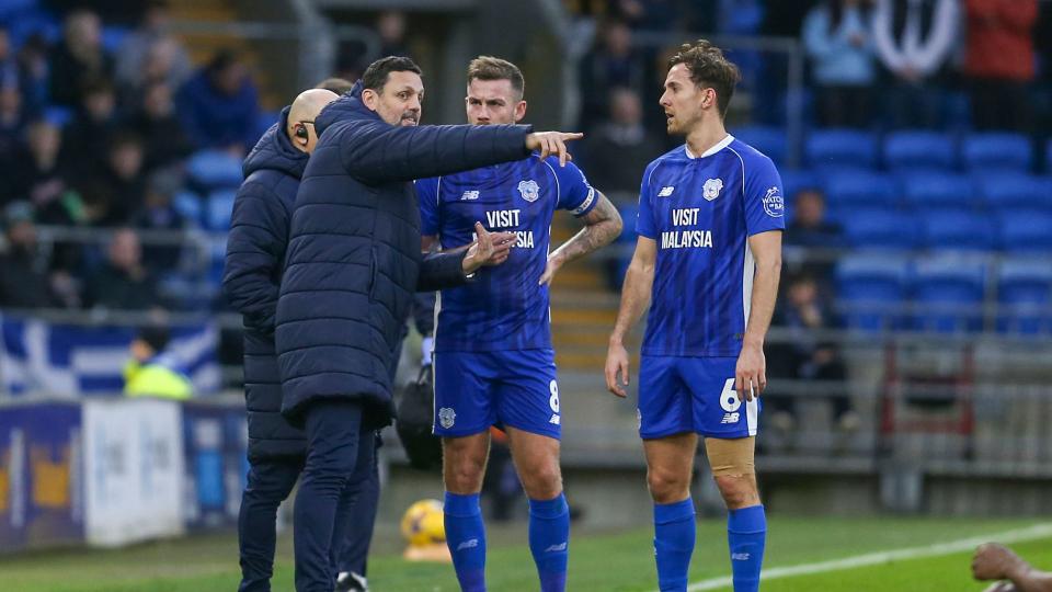 Joe Ralls and Ryan Wintle receive instructions from Erol Bulut