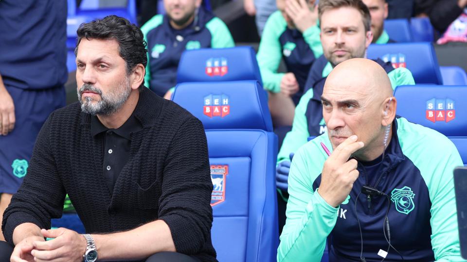 Erol Bulut and Nikolaos Karydas in the dugout