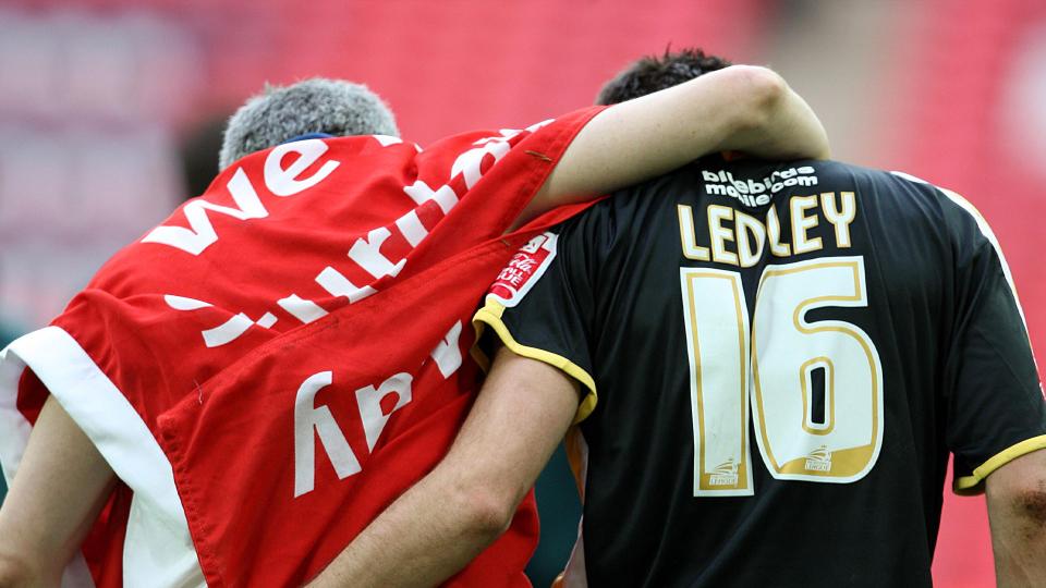 Kevin McNaughton celebrates defeating Barnsley with Joe Ledley