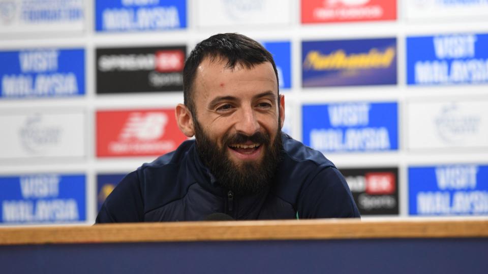 Manolis Siopis speaks to the press