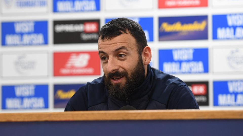 Manolis Siopis speaks to the press