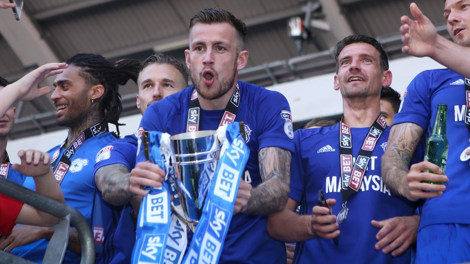 Rallsy lifts the trophy...