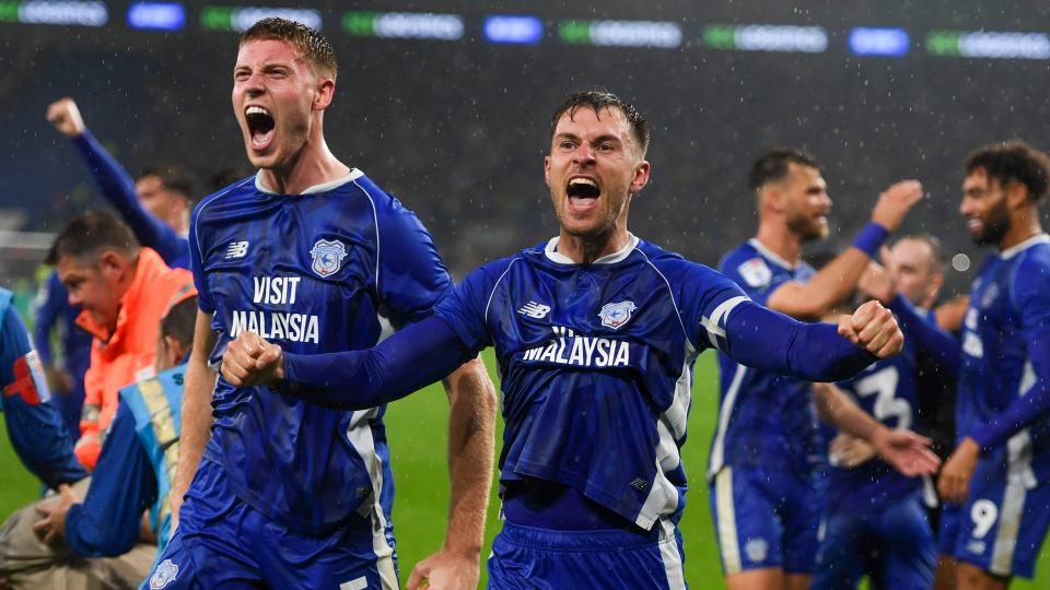 Mark McGuinness and Aaron Ramsey celebrate...