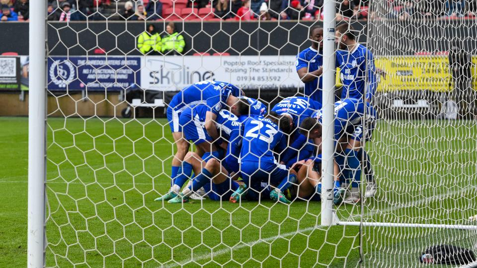 Perry Ng celebrates his Severnside derby goal...