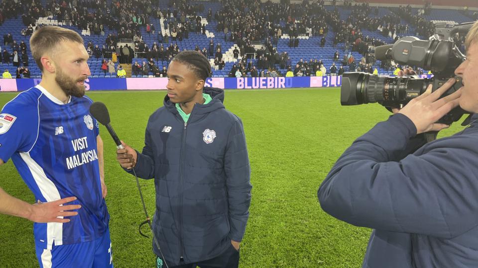 Dylan Lawlor operates a camera, as Tanatswa Nyakuhwa interviews Nat Phillips