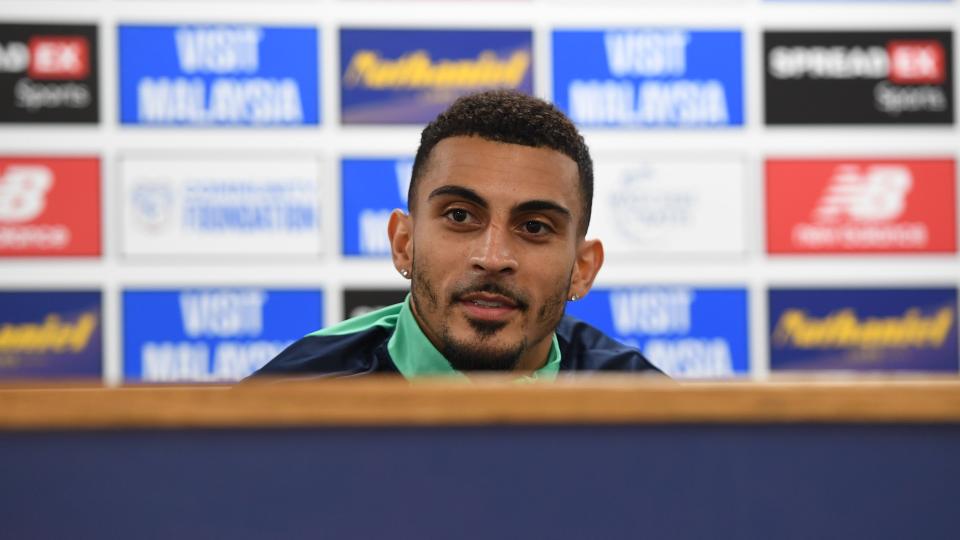 Karlan Grant speaks to the press