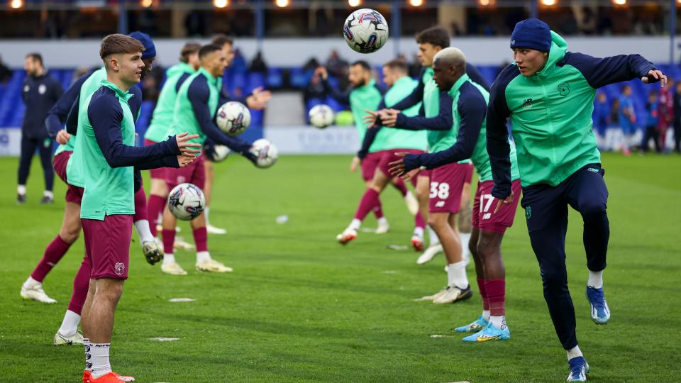 Cian Ashford and Rubin Colwill warm up together pre-match.