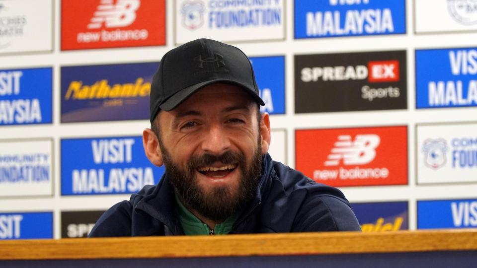 Manolis Siopis speaks to the press