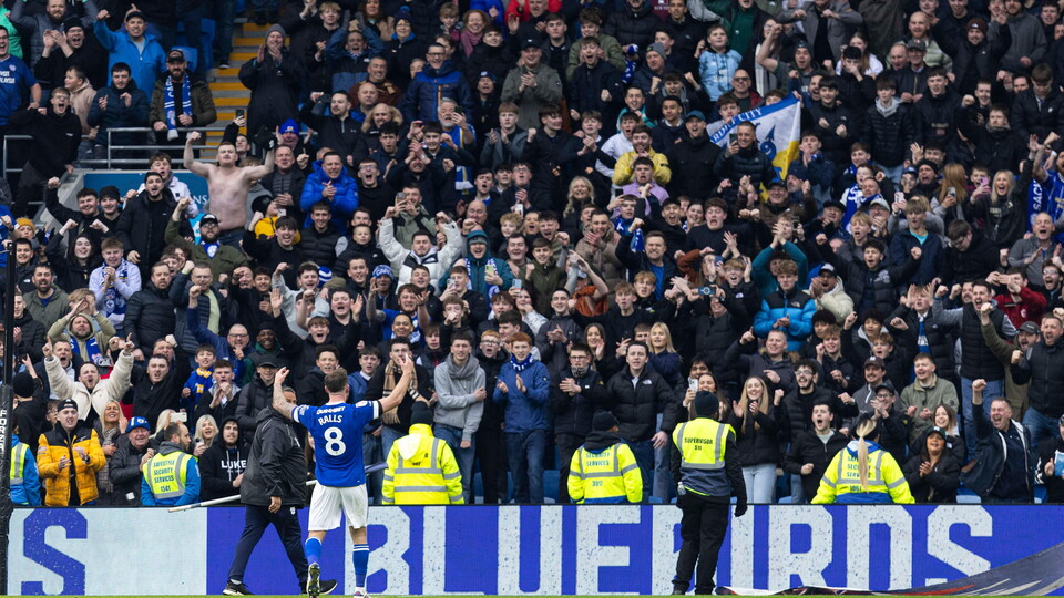City skipper Joe Ralls celebrates with the Bluebirds support...
