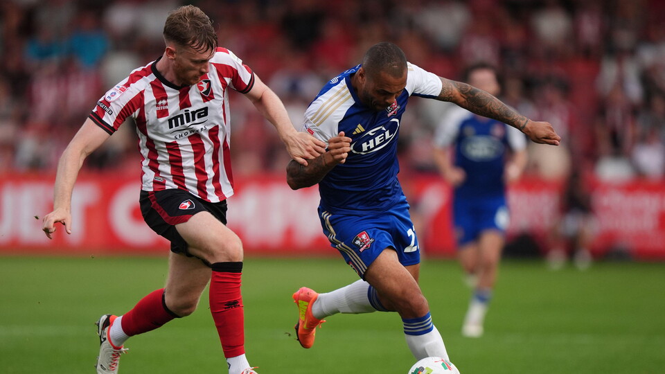 Former Bluebird Josh Magennis in action against Cheltenham Town.