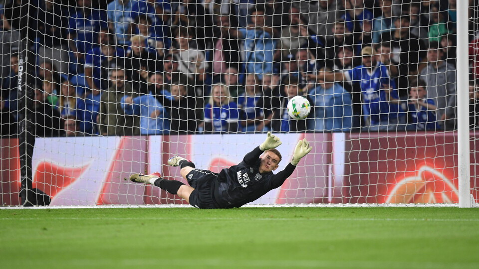 Matthew Turner saves a penalty kick against Cheltenham Town.