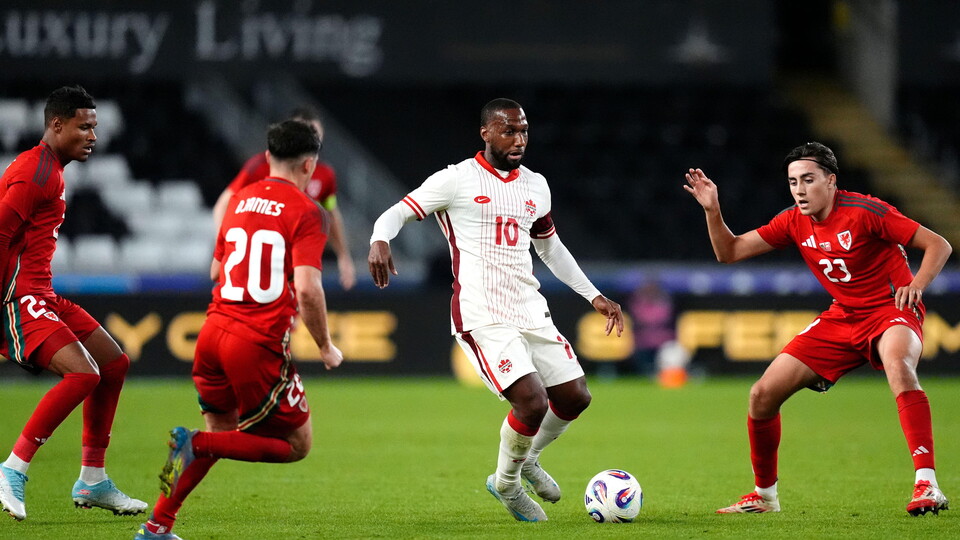 Joel Colwill in action for Wales against City and Canada legend, Junior Hoilett.