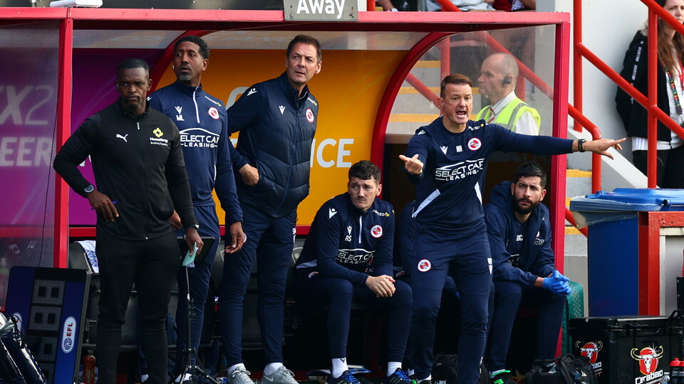 The Reading staff on the touchline.
