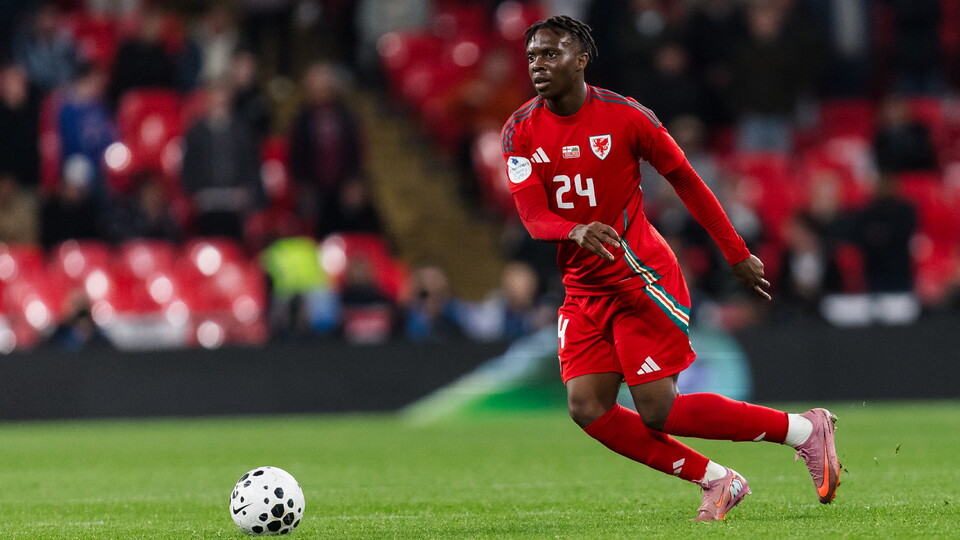 Ronan Kpakio in action for Wales against England at Wembley Stadium