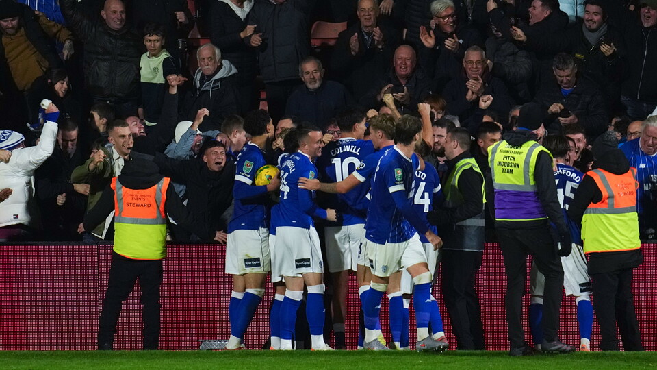 The Bluebirds celebrate their winner at Wrexham.