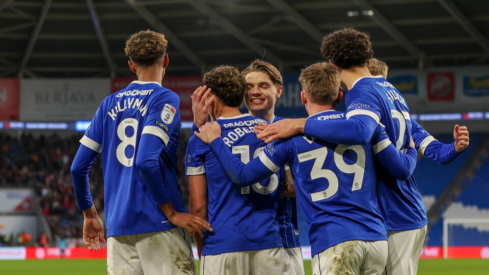 Alex Robertson celebrates his winning goal with his teammates.