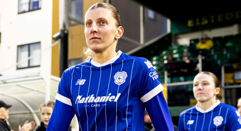 Shannon Evans walks out to represent Cardiff City at a match.
