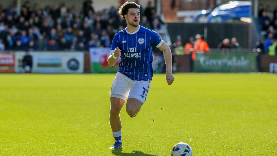 Ollie Tanner drives down the field against Exeter City.