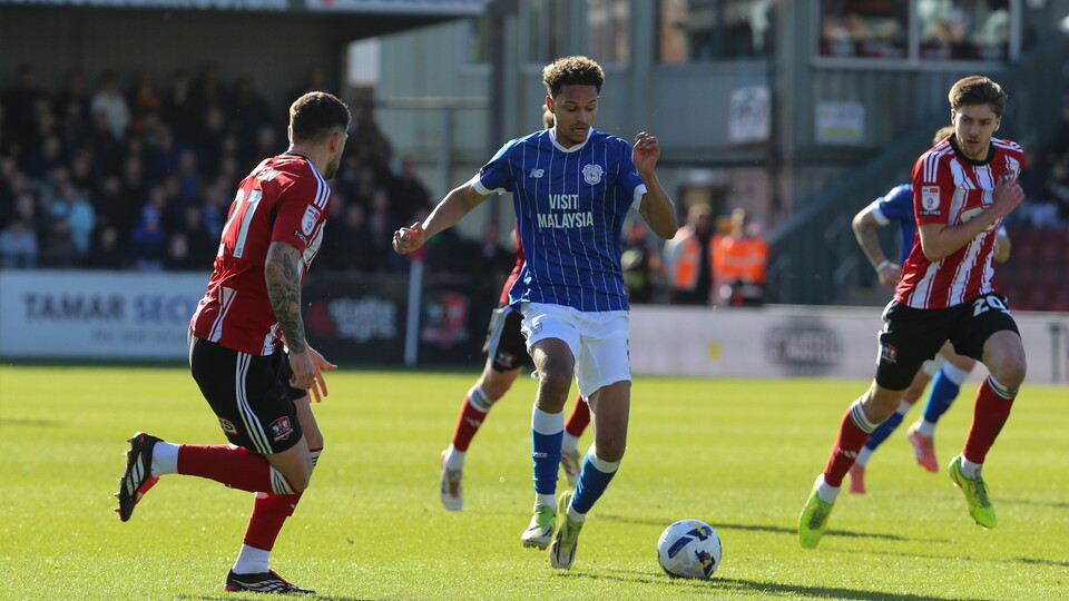 Omari Kellyman dribbles the ball against Exeter City.