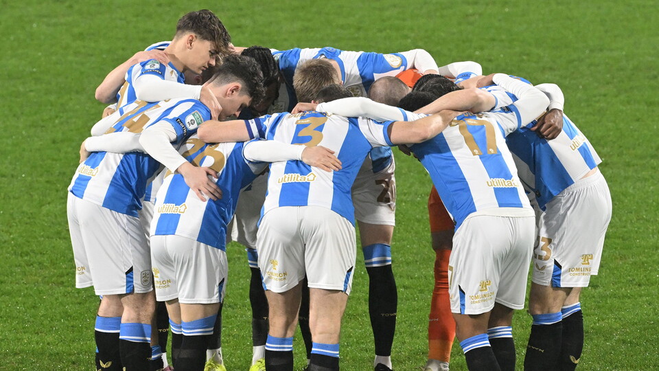 Huddersfield Town in a huddle pre-match.