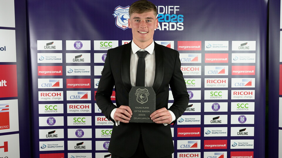 Dylan Lawlor holds his Young Player of the Season award.