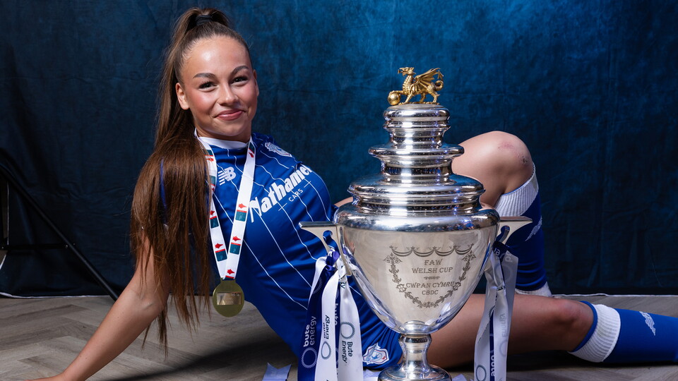 City’s Maddison Perrott celebrates with the Bute Energy Welsh Cup trophy.