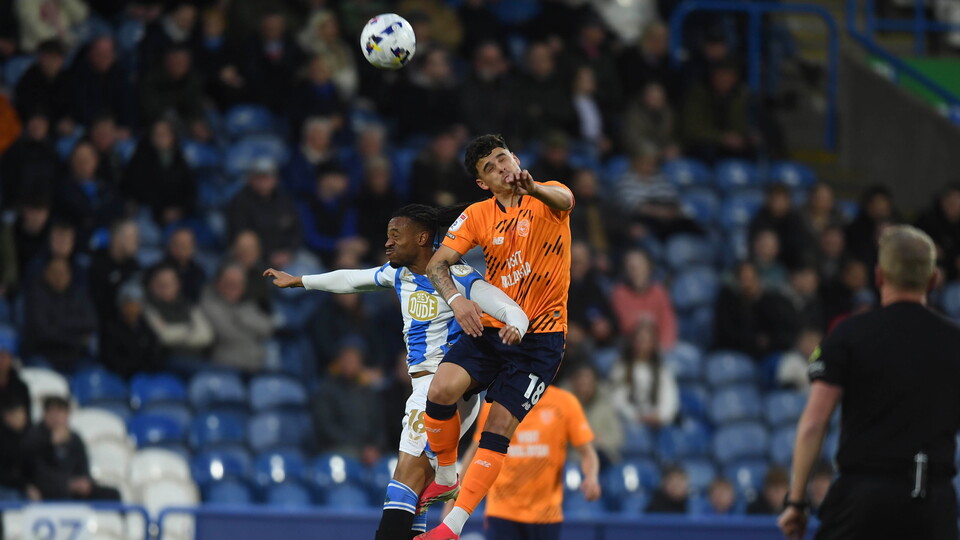 Alex Robertson in action for City at Huddersfield Town.
