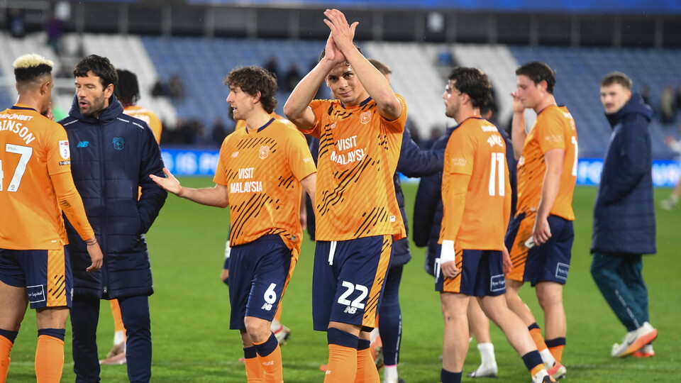 Yousef Salech applauds the City support at Huddersfield Town.