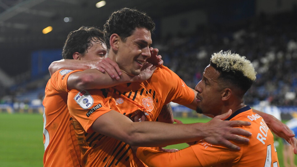 Yousef Salech celebrates his late equaliser with Callum Robinson.