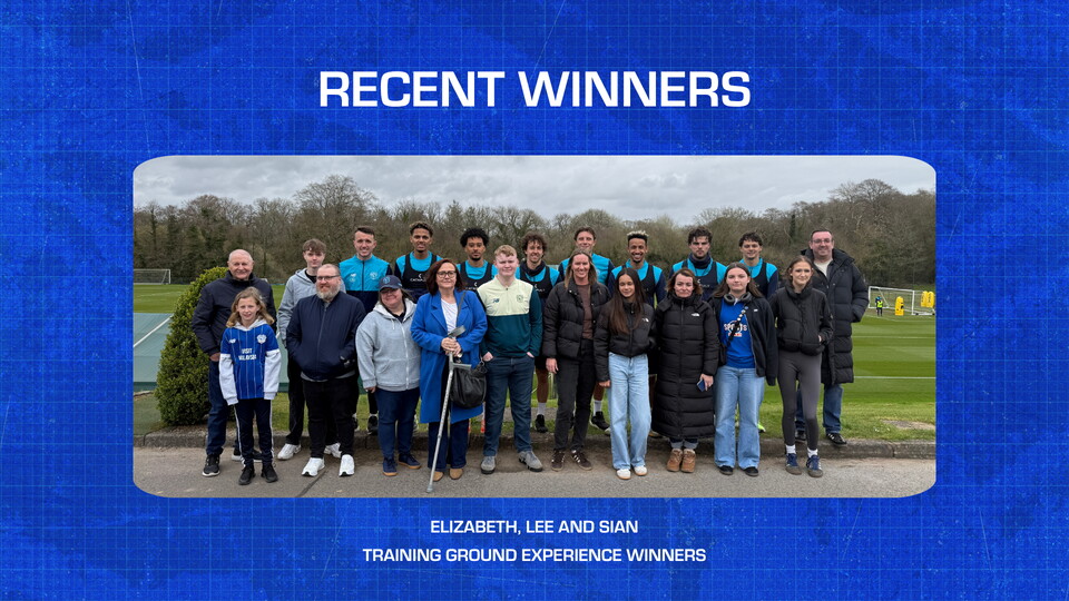 Bluebirds Rewards winners standing with the First Team