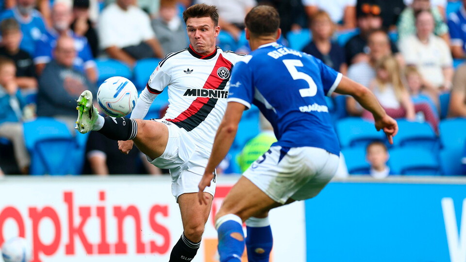 Krystian Bielik battles for the ball against Sheffield United.