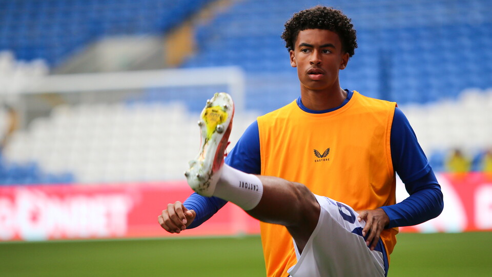 Noah Anyadike pictured warming up ahead of his First Team debut at Cardiff City Stadium.