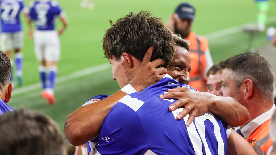 Rubin Colwill celebrates his equalising goal with Callum Robinson.