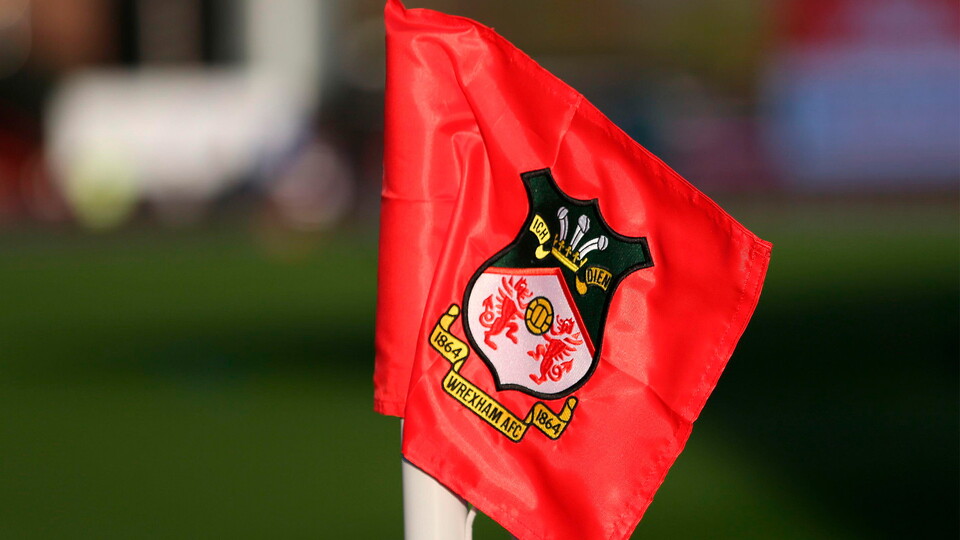 Corner flag with Wrexham AFC’s crest on it.