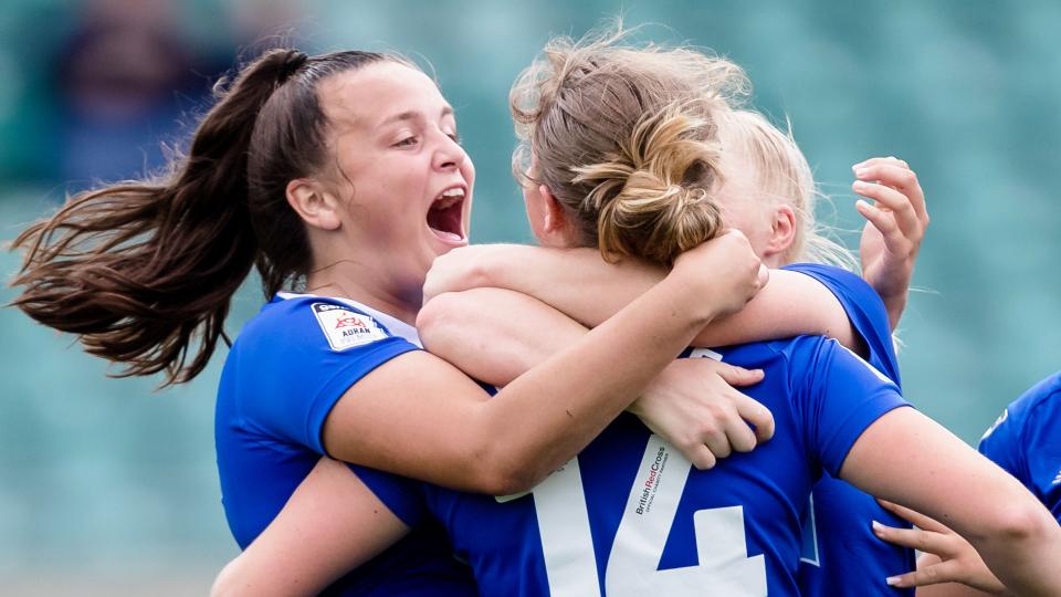 Hollie Smith celebrates with Phoebie Poole...