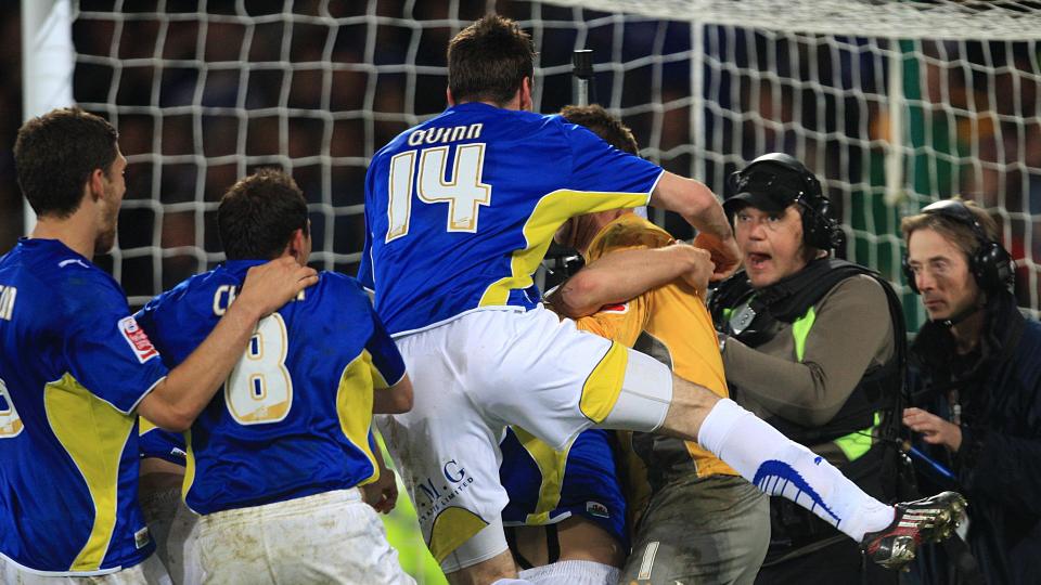 Marshall celebrates with the City squad...