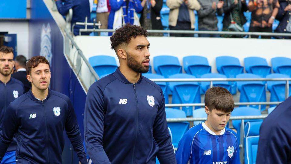 Kion Etete walks out onto the pitch at Cardiff City Stadium