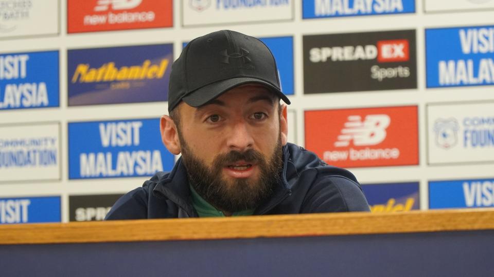 Manolis Siopis speaks to the press